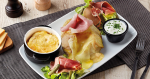An American Tourist Broke French Twitter With a Ham and Cheese–Topped Baked Potato