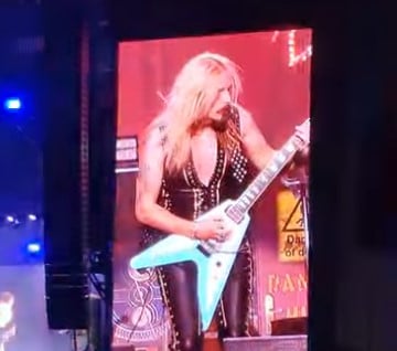 Vaccinated Judas Priest Guitarist Collapses on Stage, Suffers Aortic Aneurysm and Nearly Dies (VIDEO)