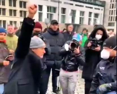 Berlin Protester Calls Police Officer a “Fascist”