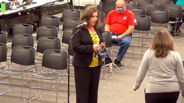 WATCH: Pro-Mask School Board Chairwoman Flees Public Meeting After Parent Shows Images Of Her Maskless