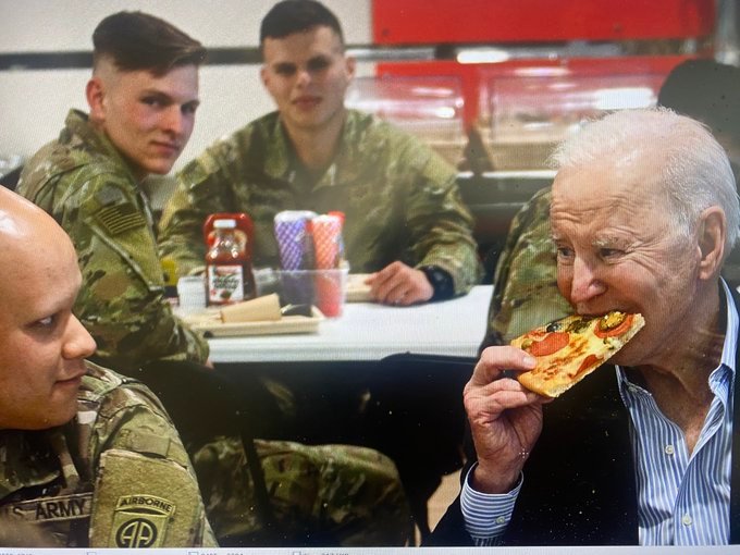 Troops Look Stunned as Joe Biden Talks Gibberish and Stuffs Pizza Down His Face