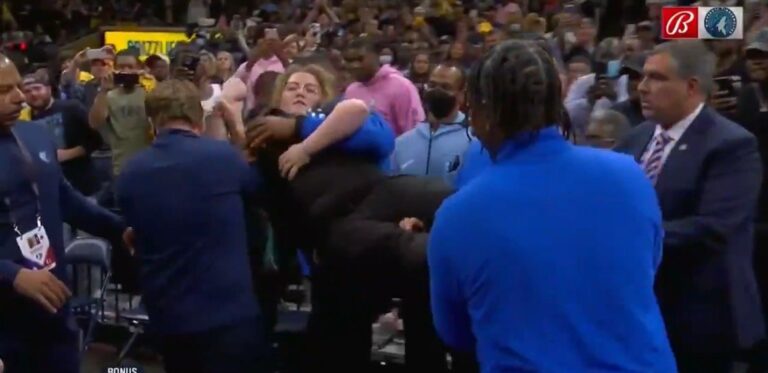 Animal Rights Activist Carried Out of Arena After Chaining Herself to Basket to Protest Timberwolves Owner (VIDEO)